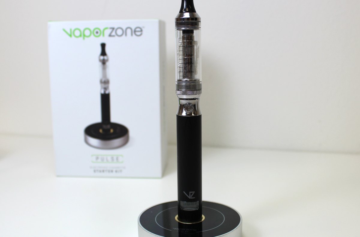 Stainless steel vape pen standing upright