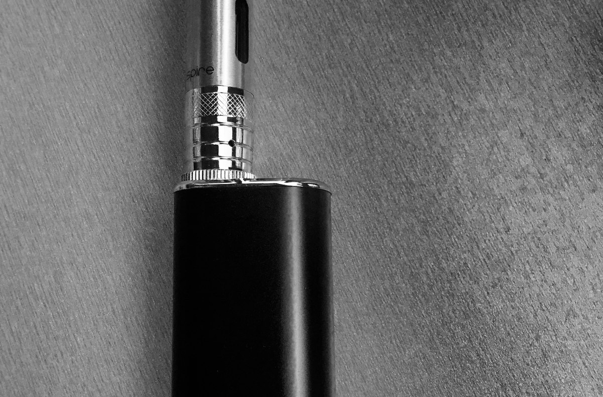 Electronic cigarette device lying on a white surface